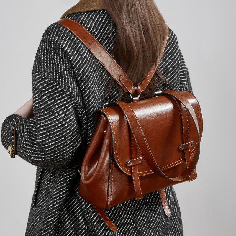 The Oil-Waxed Genuine Leather Convertible Flap Backpack Shoulder Bag
