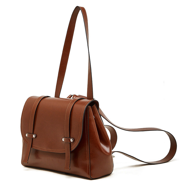 The Oil-Waxed Genuine Leather Convertible Flap Backpack Shoulder Bag